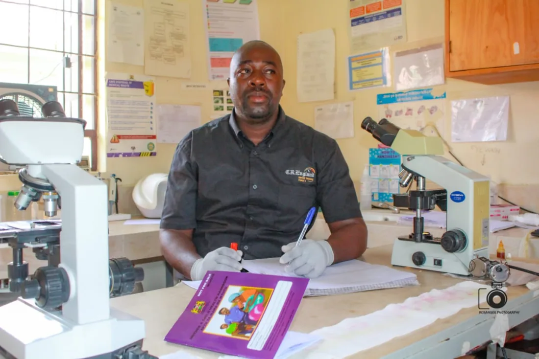 A MED25 lab technician at work in the hospital laboratory in Mbita